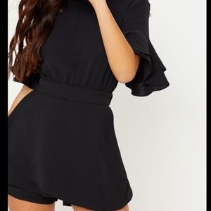 black frill sleeve tie back playsuit